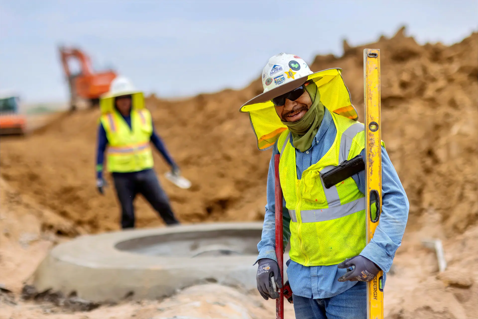 An Alpine utilities crew member smiling on site
