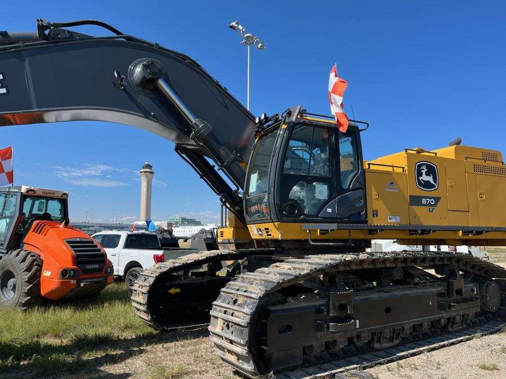 Excavator and construction equipment at airport job site