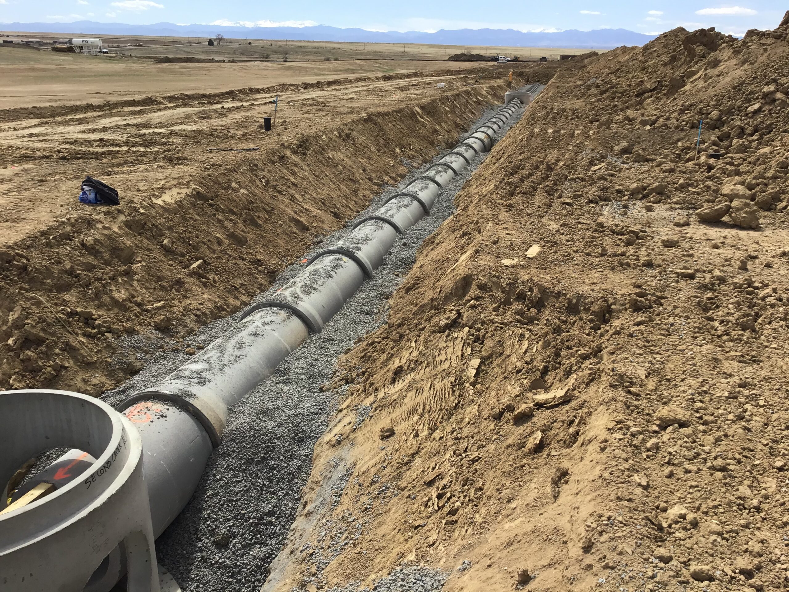 Large underground pipe installed in trench