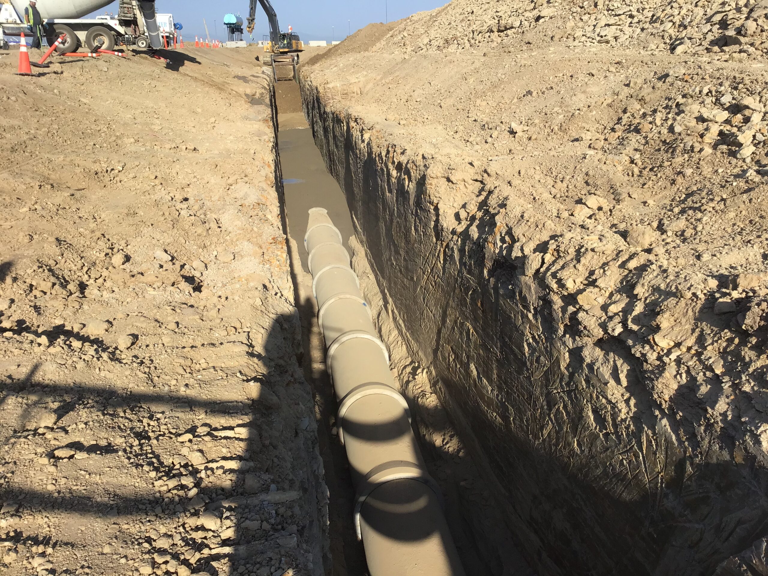 Large underground pipe installed in trench