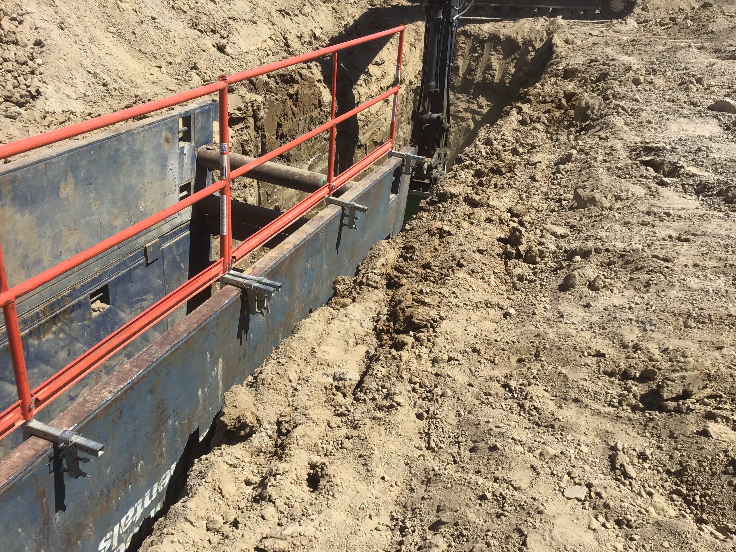 Trench box shoring system installed in deep excavation